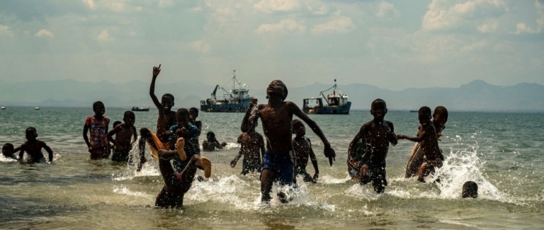 Children play at Lake Malawi