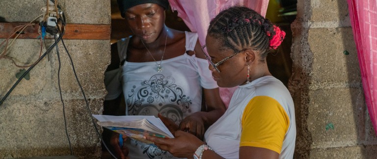 A case worker and client in Dominican Republic