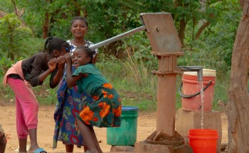A family from Pact's "Children Out of Mining" project in DRC. Photo credit: Maynard Mwanza Muchangwe for Pact. 