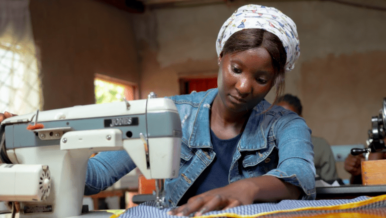 A woman who participated in the Children Out of Mining activities. Photo by Maynard Muchangwe for Pact. 