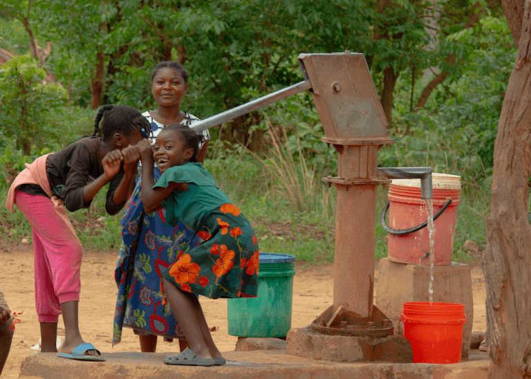 A family from Pact's "Children Out of Mining" project in DRC. Photo credit: Maynard Mwanza Muchangwe for Pact. 